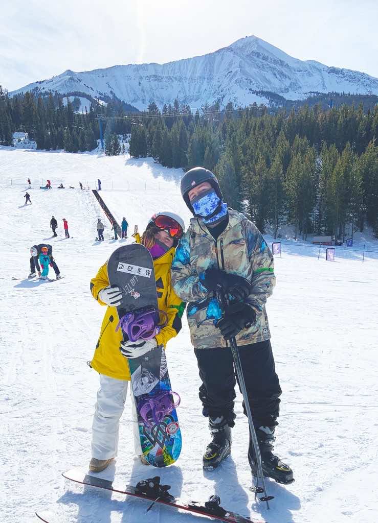 Two people with snowboards