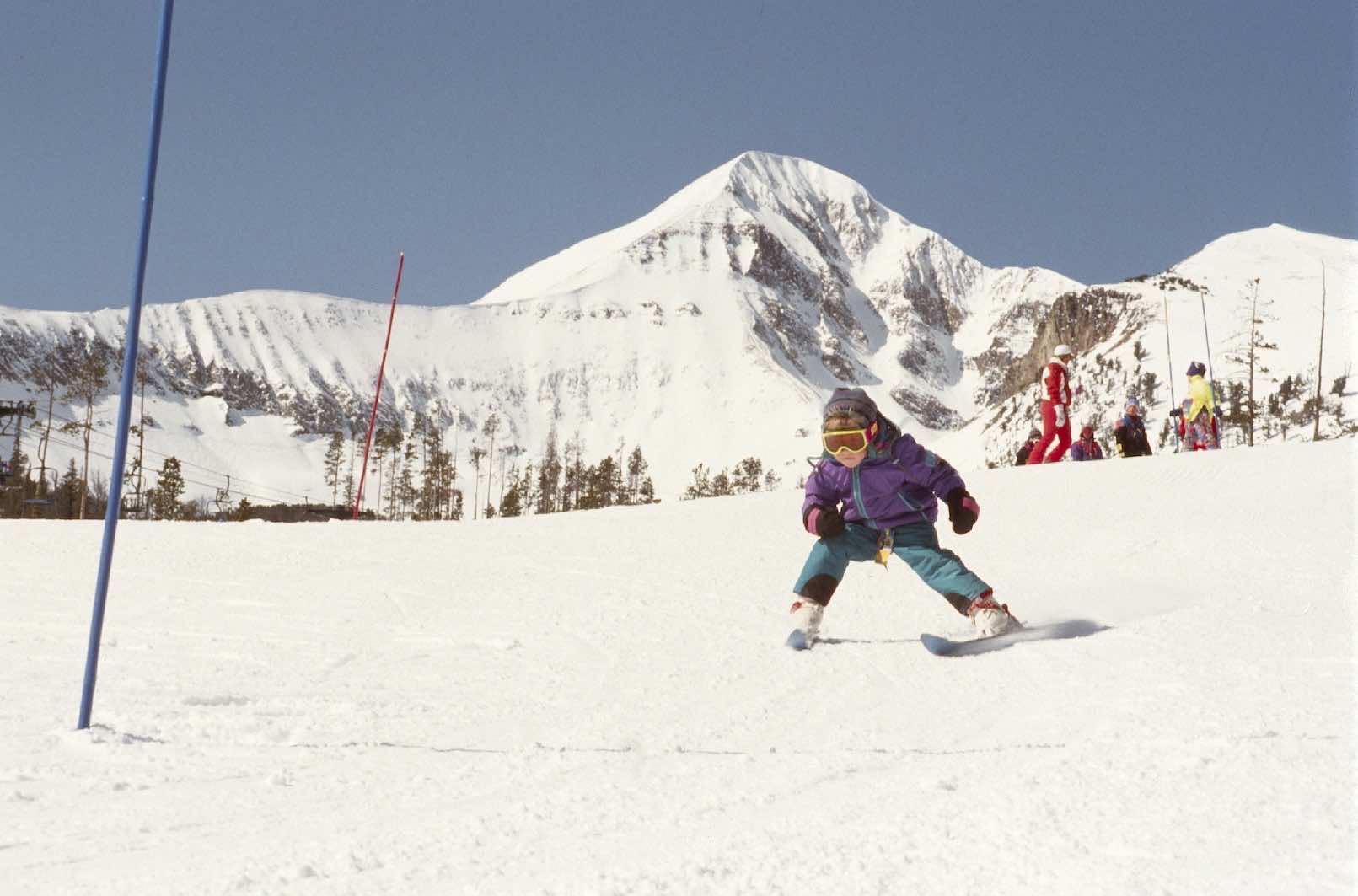 Historic photo of a child skiing at Big Sky Resort