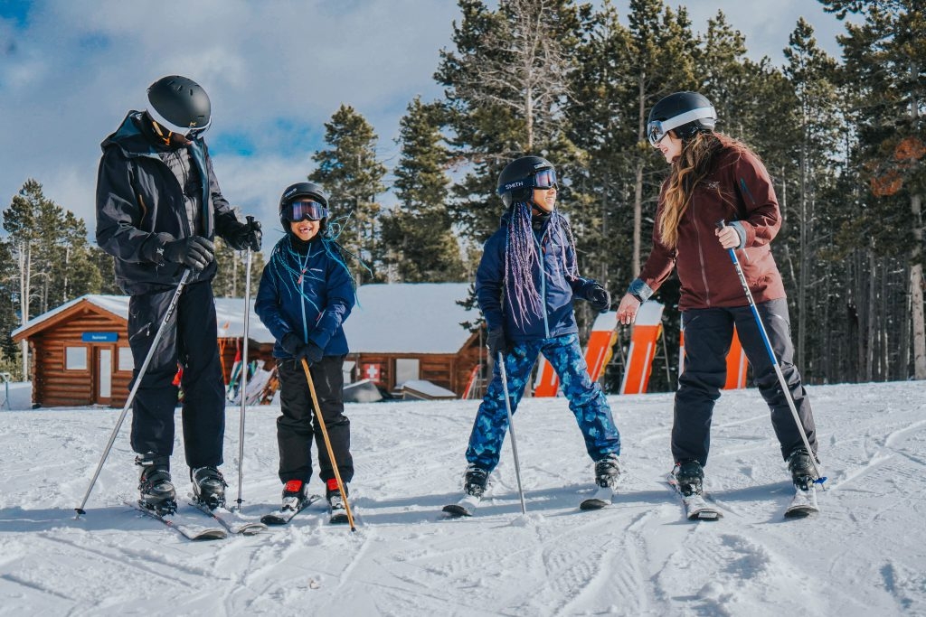 Family standing in ski gear