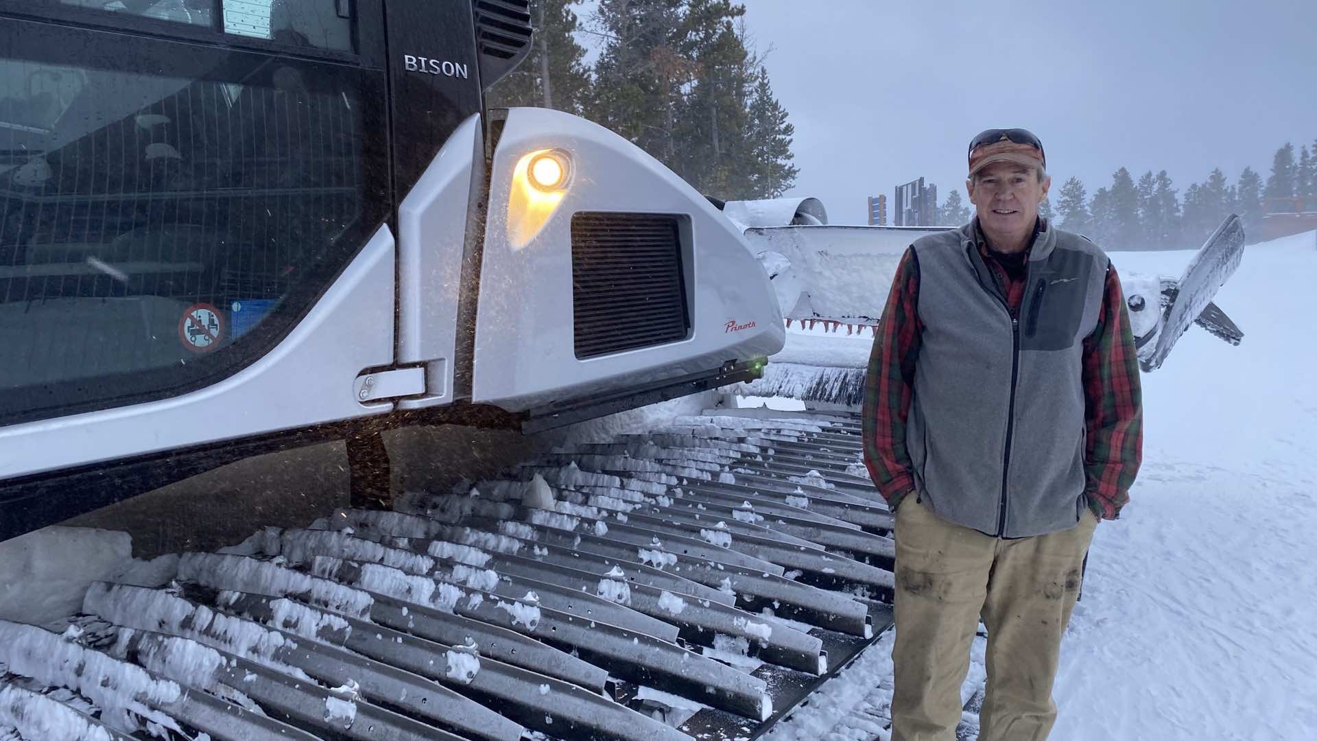 Man standing in front of a snowcat
