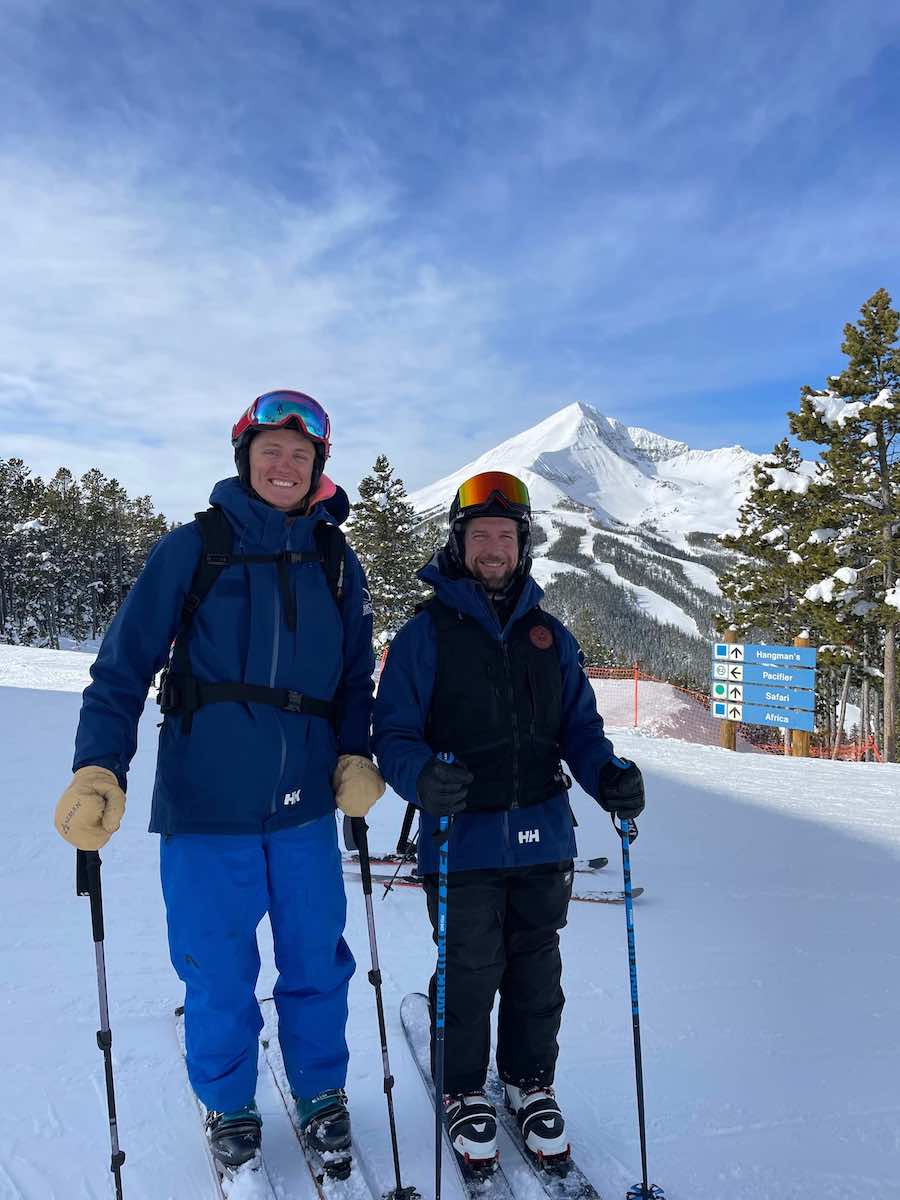 Snow Reporters Joe Turner & Mario Carr, standing in Big Sky uniforms